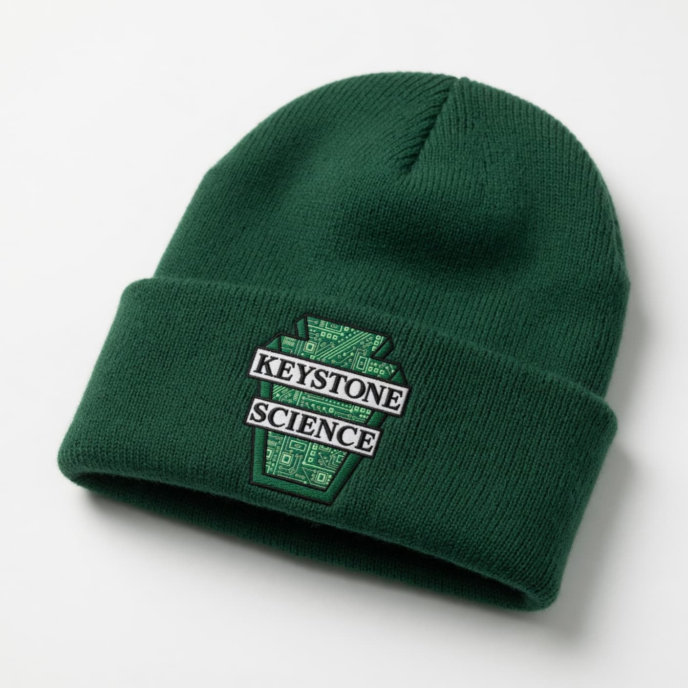 Green knit beanie with Keystone Science logo patch