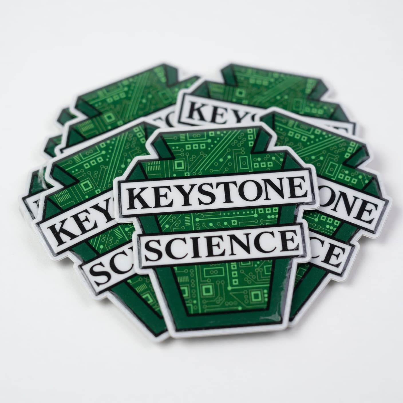 Stack of Keystone Science vinyl logo stickers